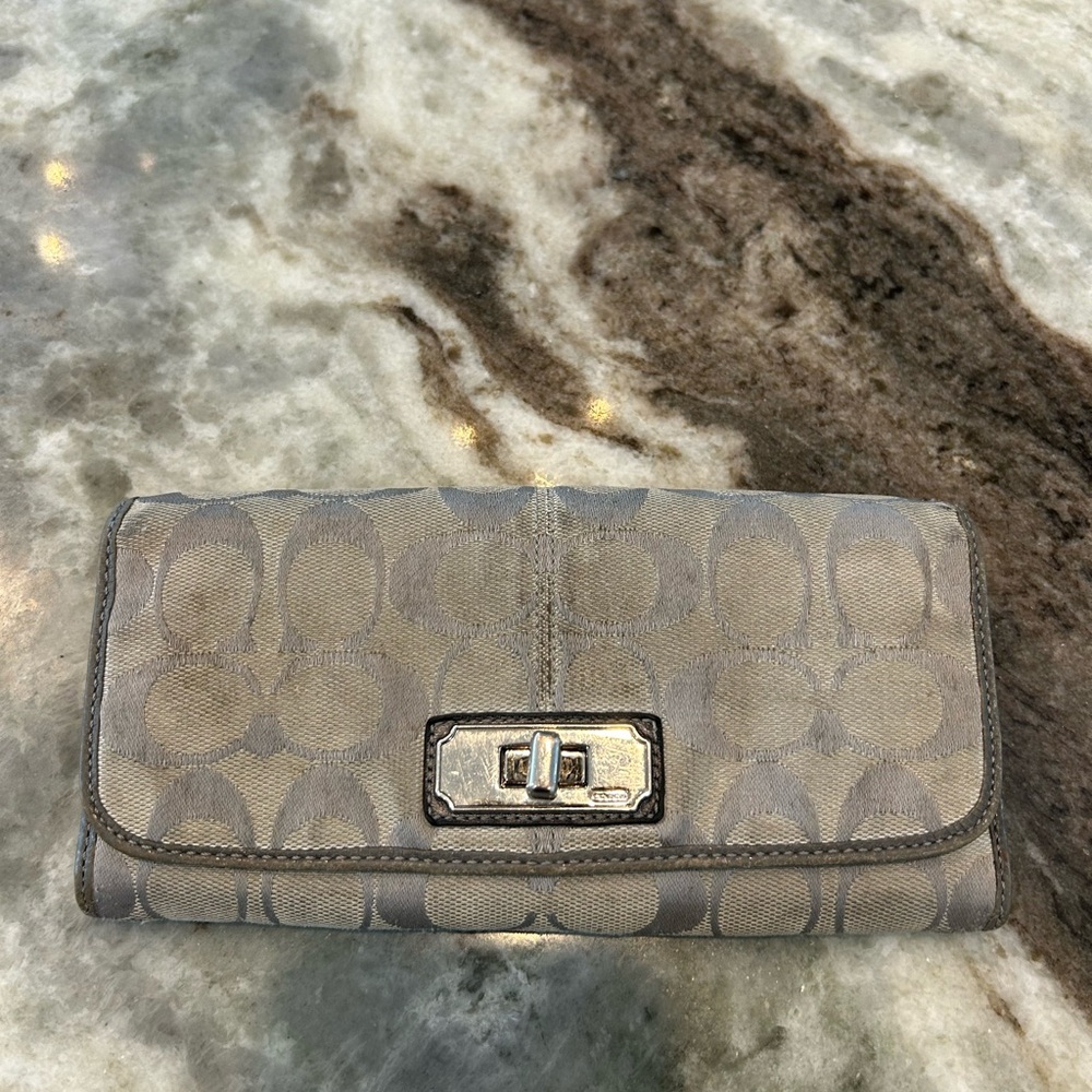 Coach gray canvas turn lock Wallet has wear missing tiny screw